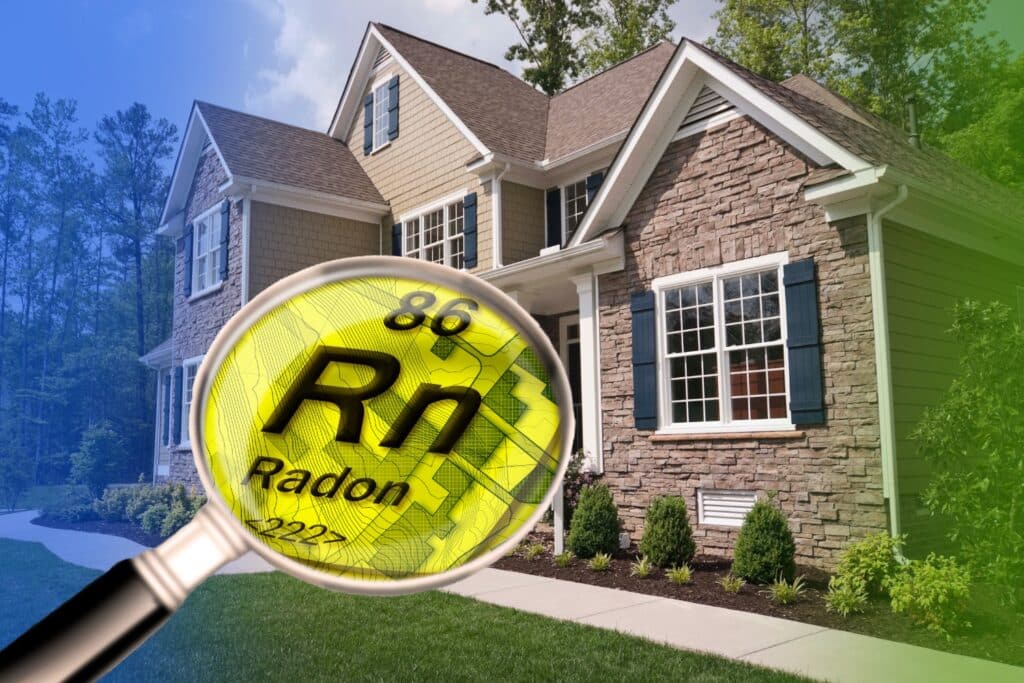 A magnifying glass displaying the periodic symbol for radon (Rn) over a suburban home, illustrating residential radon gas detection.